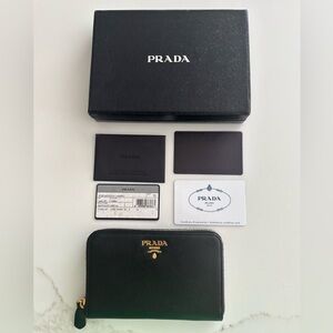 Black PRADA Saffiano zip around wallet with gold hardware.EXCELLENT CONDITION.